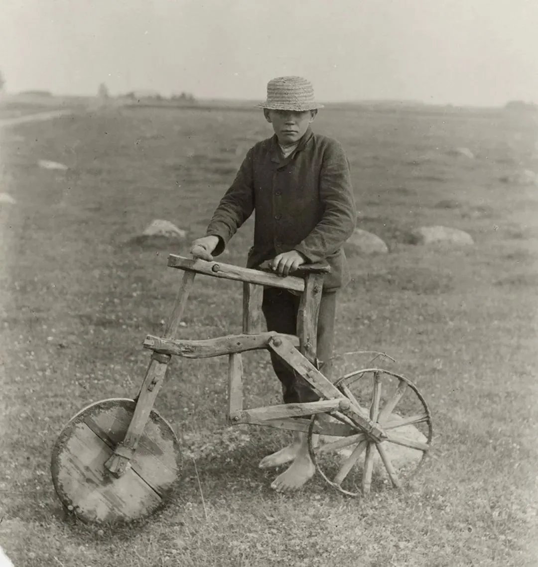 Boy with a handmade bicycle, 1912